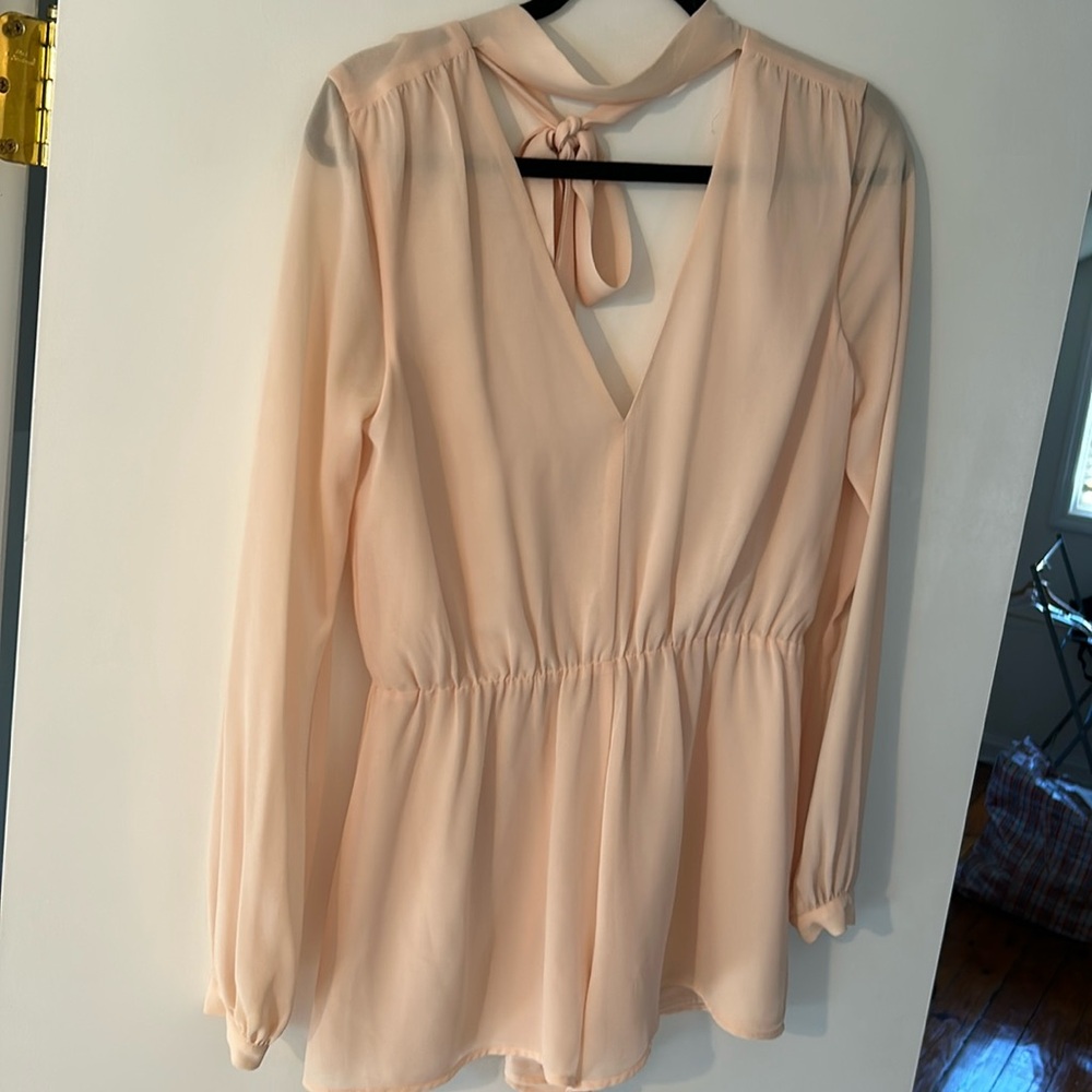 Lovers + Friends ballet slipper pink sheer long sleeve romper with open back